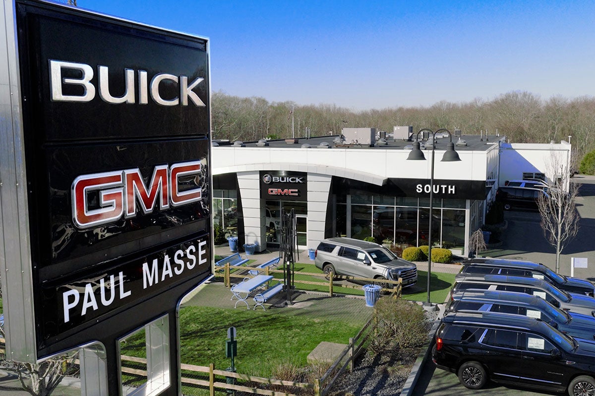 Paul Masse dealership in background with cars