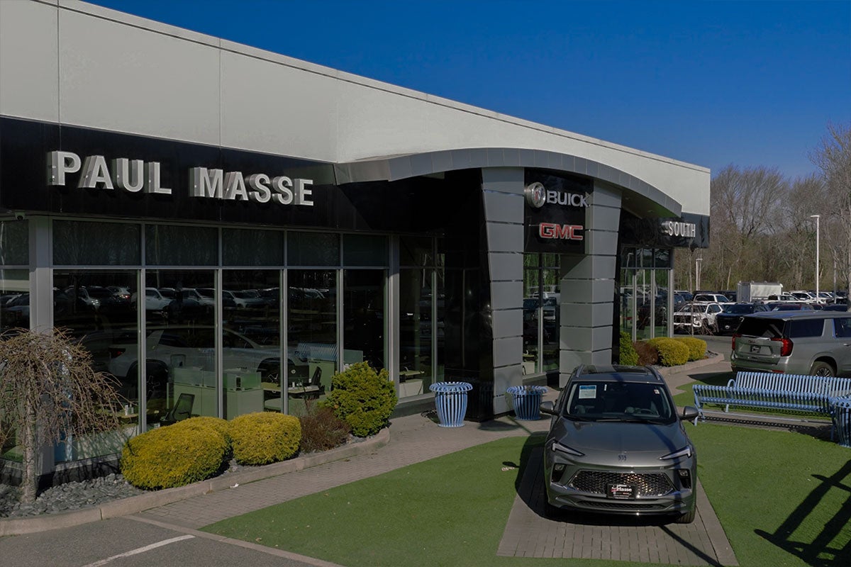 Paul Masse dealership in background with cars